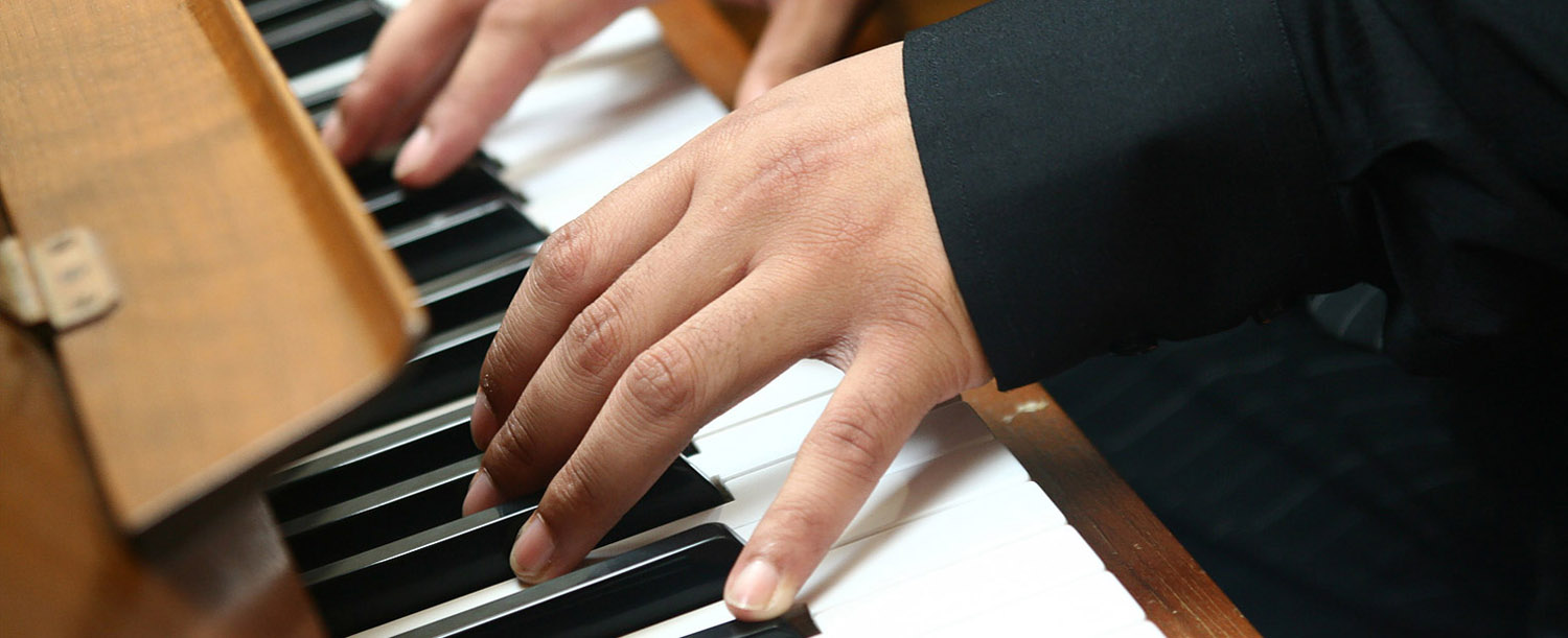adult performing piano at manhattan recital