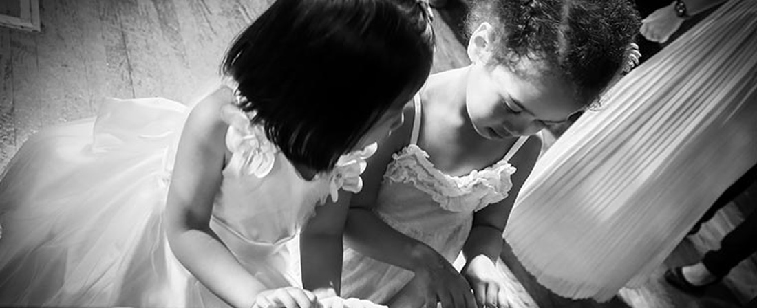 two girls playing piano together