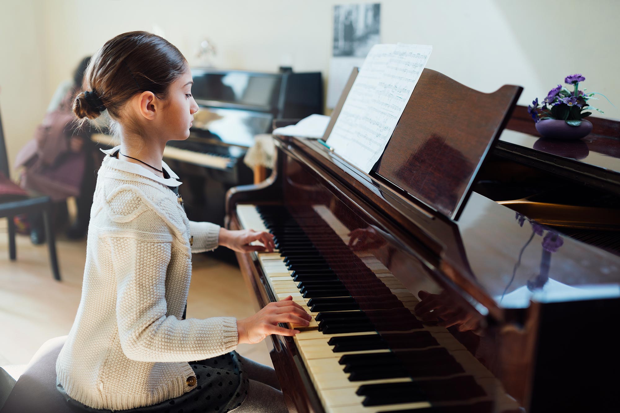 teenage-girl-practicing-piano